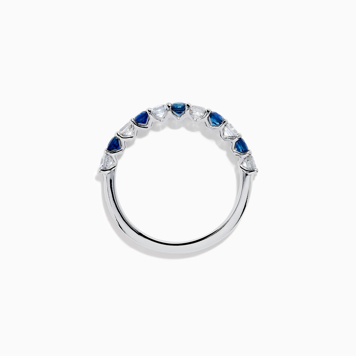 The Royale Bleu 14K White Gold Blue and White Sapphire Band Ring features alternating round blue and white sapphires on a sleek white gold band, shown against a white background.