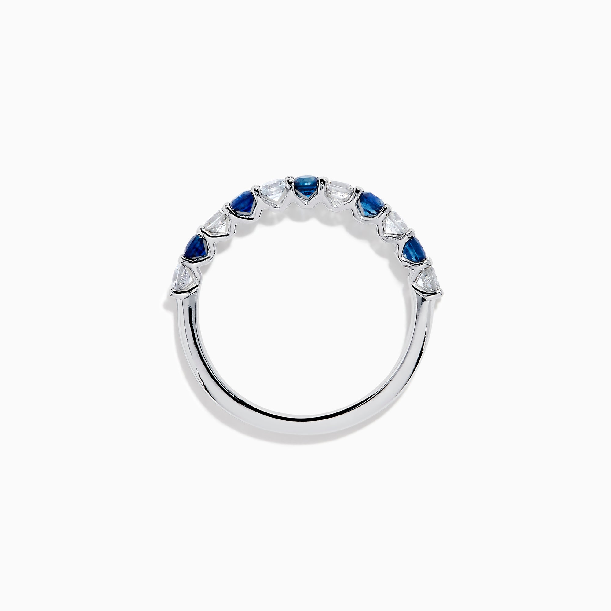 The Royale Bleu 14K White Gold Blue and White Sapphire Band Ring features alternating round blue and white sapphires on a sleek white gold band, shown against a white background.