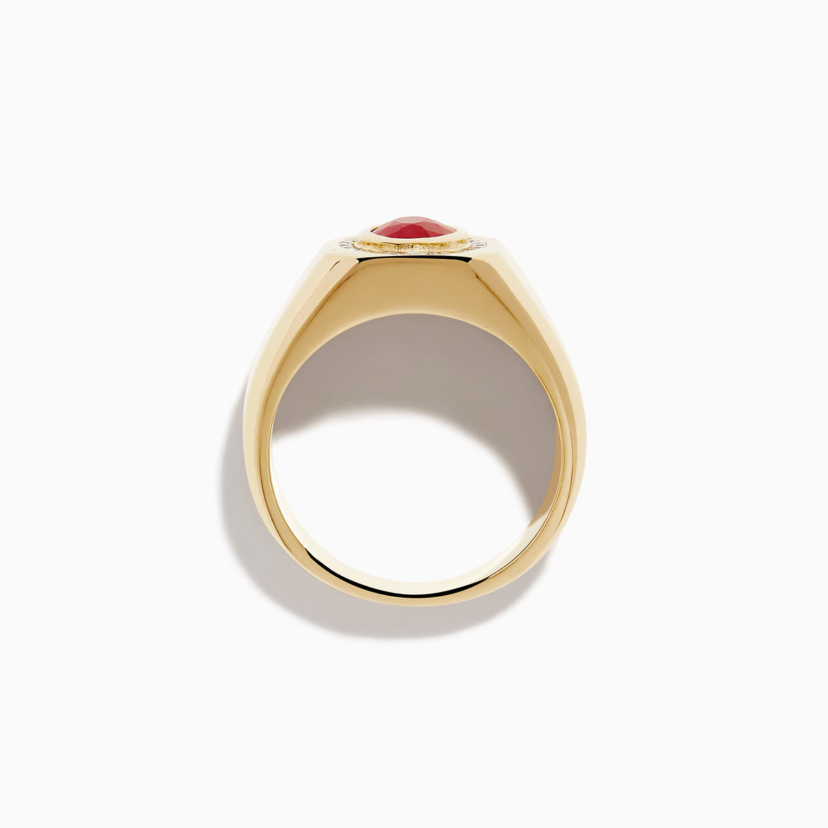 The Men's 14K Yellow Gold Bezel Halo Ruby and Diamond Signet Ring showcases an oval ruby center, encircled by a halo of white diamonds, all set in yellow gold against a white background.