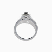 The 14K White Gold White and Black Diamond Halo Ring features an oval black center stone, a halo of white diamonds, and additional diamonds set along its split shank band.