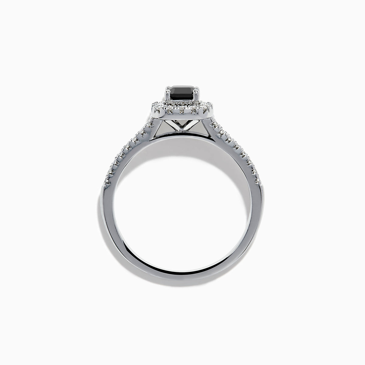 The 14K White Gold White and Black Diamond Halo Ring features a rectangular black center stone surrounded by white diamonds, with more diamonds along the band, all presented on a white background.
