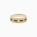 The Mens 14K Yellow Gold White and Black Diamond Band Ring features alternating black and white round diamonds set in the center, showcased against a plain white background.