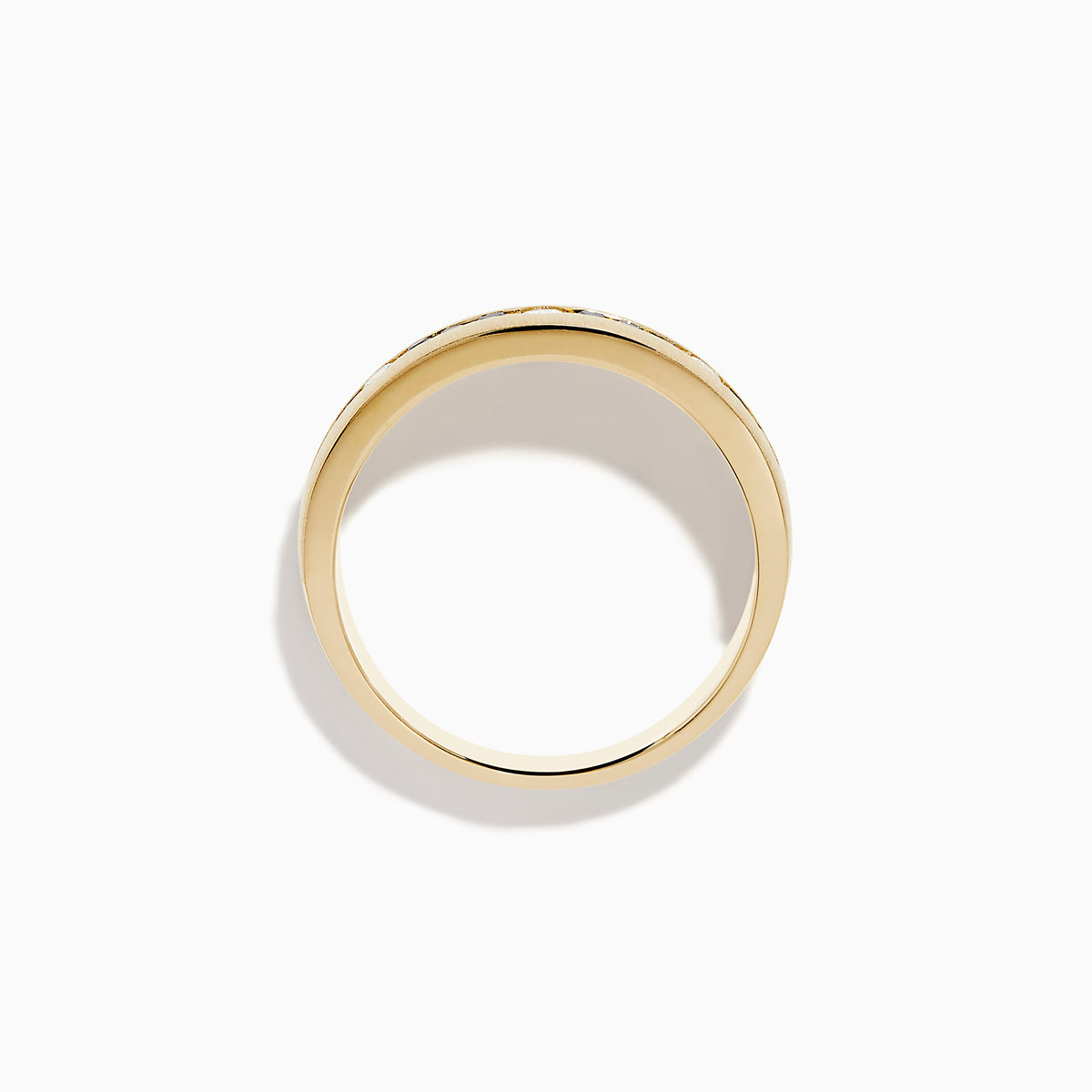 The Mens 14K Yellow Gold White and Black Diamond Band Ring features alternating black and white round diamonds set in the center, showcased against a plain white background.