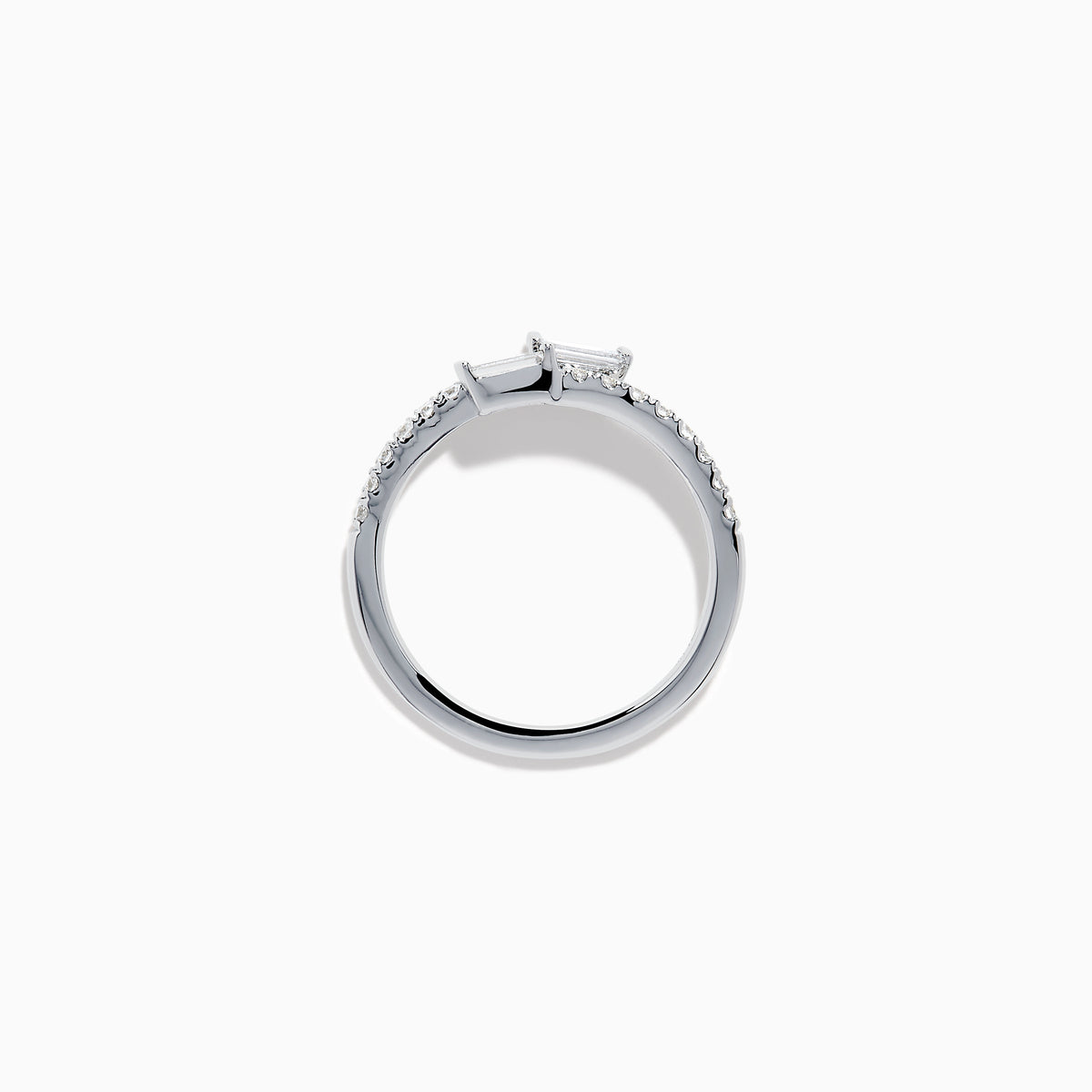 The 14K White Gold Diamond Bypass Ring features two rectangular baguette-cut diamonds at each end and a row of small round diamonds along the band, beautifully set against a white background.