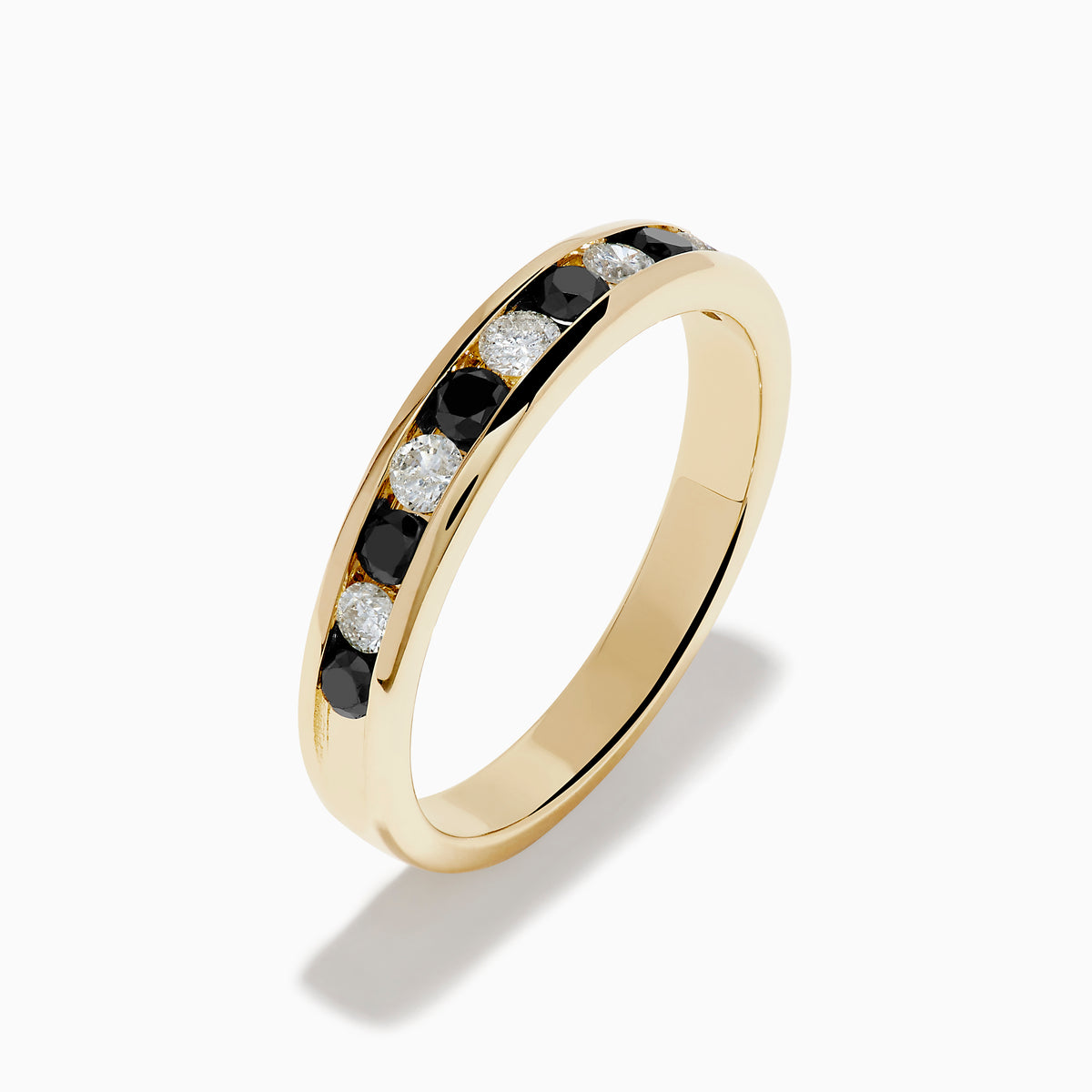 The Caviar 14K Yellow Gold Black and White Diamond Band Ring features alternating black and white diamonds in a channel setting, shown against a plain white background.
