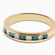 The Bella Bleu 14K Yellow Gold White and Blue Diamond Ring features alternating round blue and white diamonds in a single row, displayed on a plain white background.