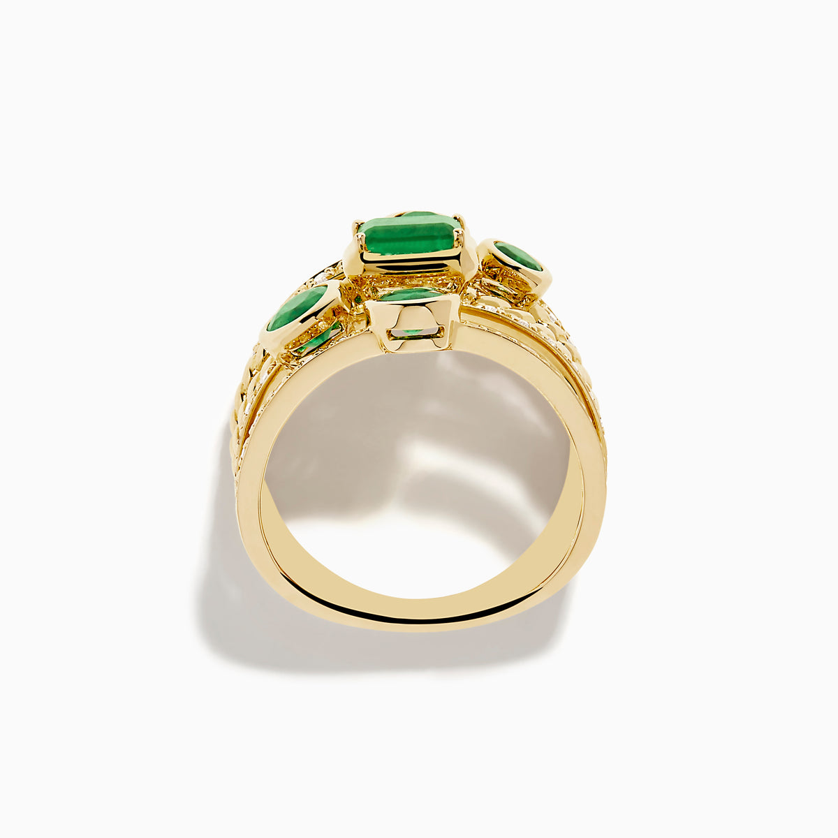 The 14K Yellow Gold Emerald and Diamond Statement Ring features five stacked bands, each adorned with emeralds and white accent stones in an intricate diamond design.