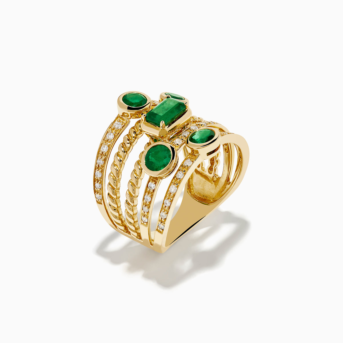 The 14K Yellow Gold Emerald and Diamond Statement Ring features five stacked bands, each adorned with emeralds and white accent stones in an intricate diamond design.