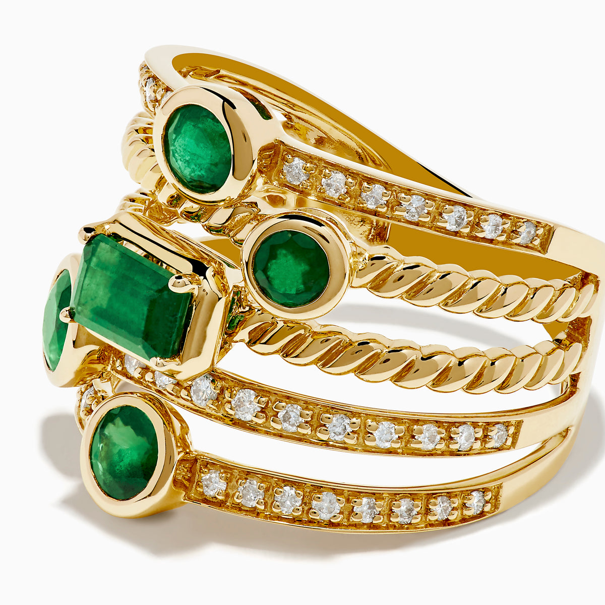 The 14K Yellow Gold Emerald and Diamond Statement Ring features five stacked bands, each adorned with emeralds and white accent stones in an intricate diamond design.