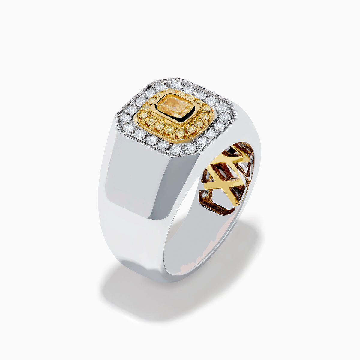 The Mens 18K Two-Tone Gold White and Yellow Diamond Ring features a rectangular face with a central yellow stone, framed by white and yellow diamonds in a bold geometric design.