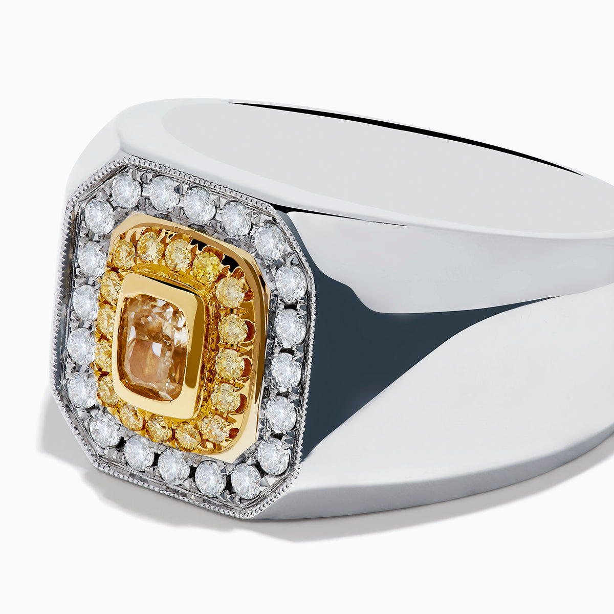 The Mens 18K Two-Tone Gold White and Yellow Diamond Ring features a rectangular face with a central yellow stone, framed by white and yellow diamonds in a bold geometric design.