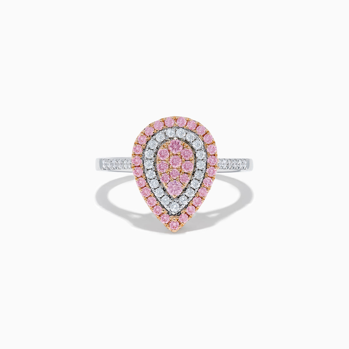 The 14K Two Tone Pink and White Diamond Ring features a teardrop shape with concentric rows of pink and white diamonds on a silver band, highlighted by a central cluster of pink stones.