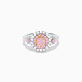 The 14K Two Tone Gold White and Pink Diamond Cluster Ring features a round cluster of pink diamonds at the center, encircled by white diamonds, with additional pink stones on each side for extra elegance.