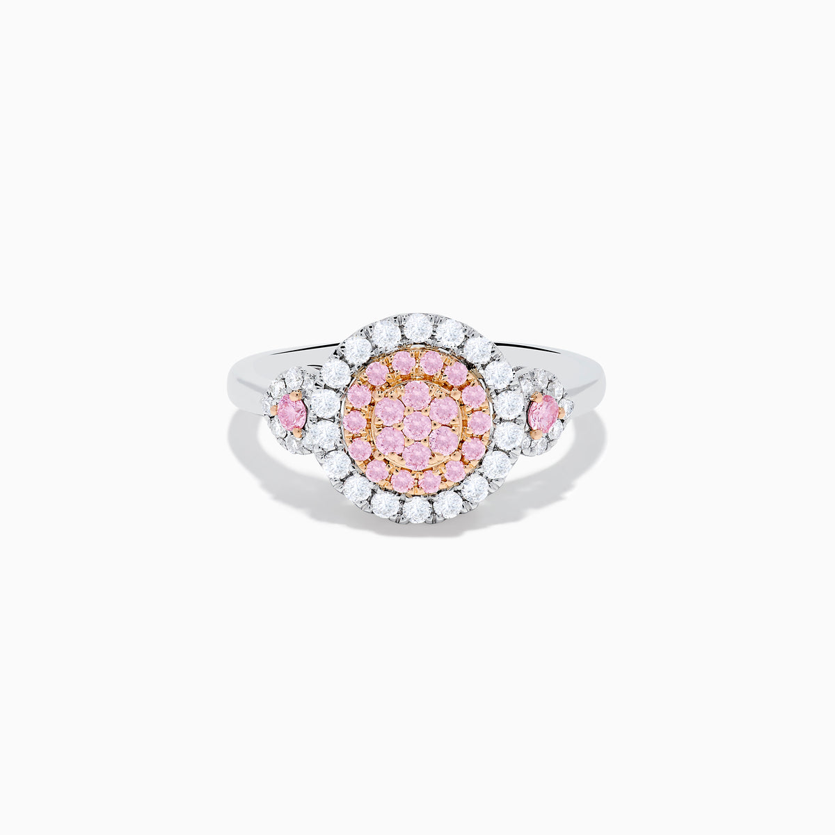 The 14K Two Tone Gold White and Pink Diamond Cluster Ring features a round cluster of pink diamonds at the center, encircled by white diamonds, with additional pink stones on each side for extra elegance.