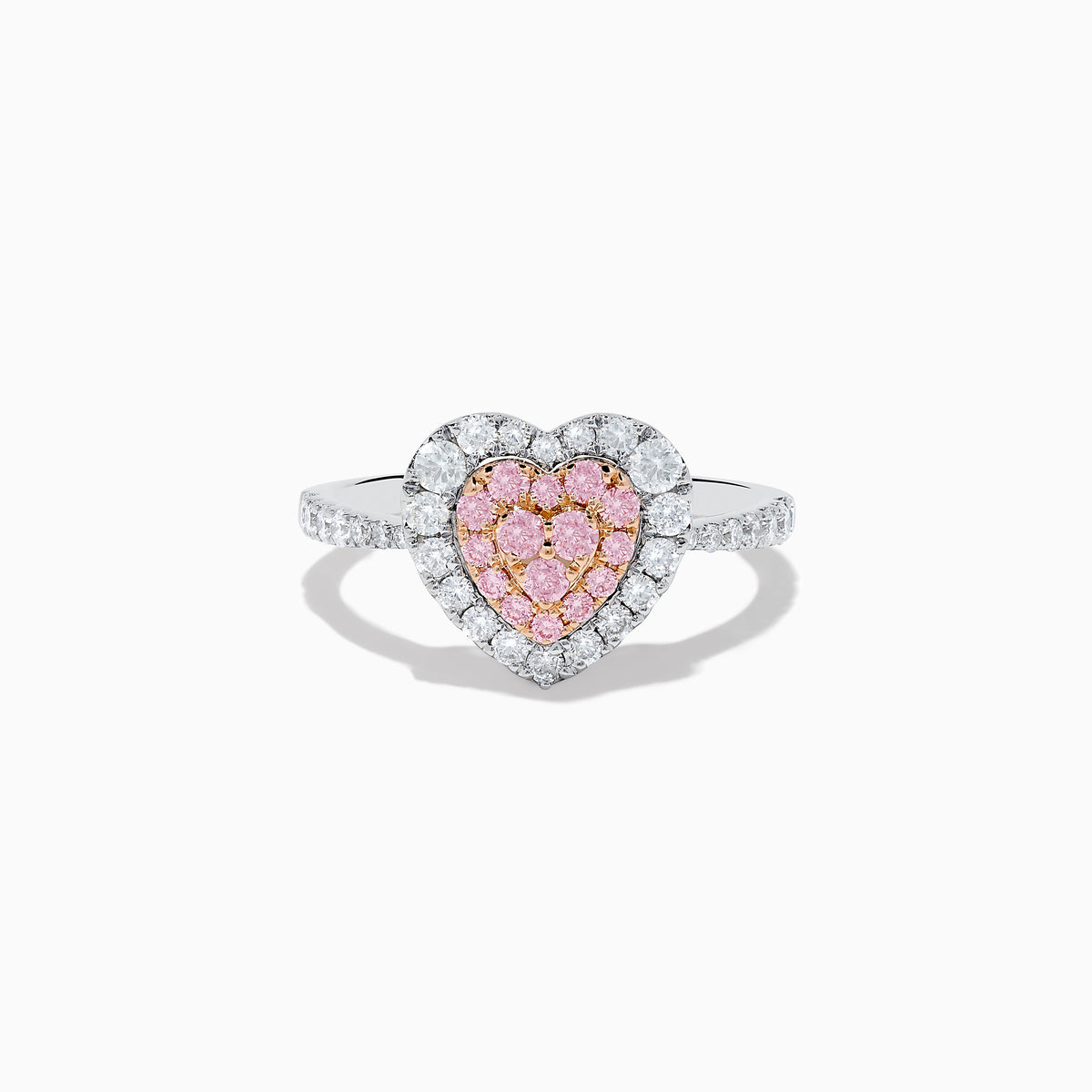 The Novelty 18K Two Tone Gold Pink and White Diamond Heart Ring showcases a heart-shaped center with pink and white diamonds, bordered by clear stones and accented with smaller stones along the band.