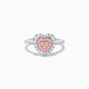 The Novelty 18K Two Tone Gold Pink and White Diamond Heart Ring showcases a heart-shaped center with pink and white diamonds, bordered by clear stones and accented with smaller stones along the band.