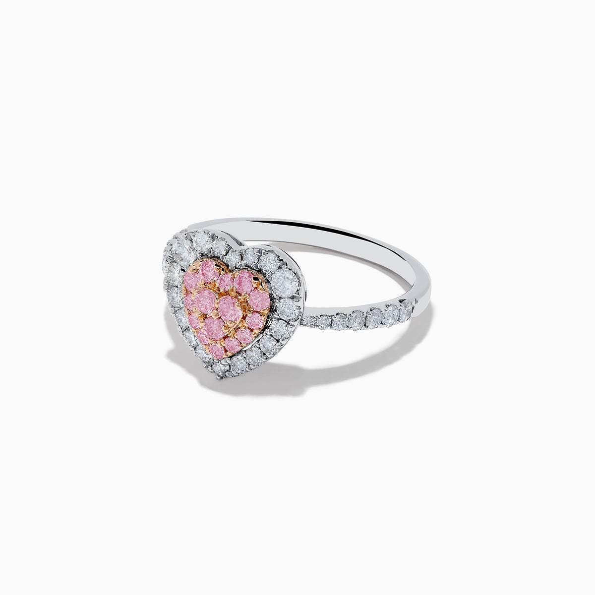 The Novelty 18K Two Tone Gold Pink and White Diamond Heart Ring showcases a heart-shaped center with pink and white diamonds, bordered by clear stones and accented with smaller stones along the band.