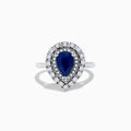 The Royale Bleu 14K White Gold Sapphire Diamond Ring showcases a pear-shaped sapphire center, encircled by two rows of sparkling round white diamonds in an elegant teardrop halo design.