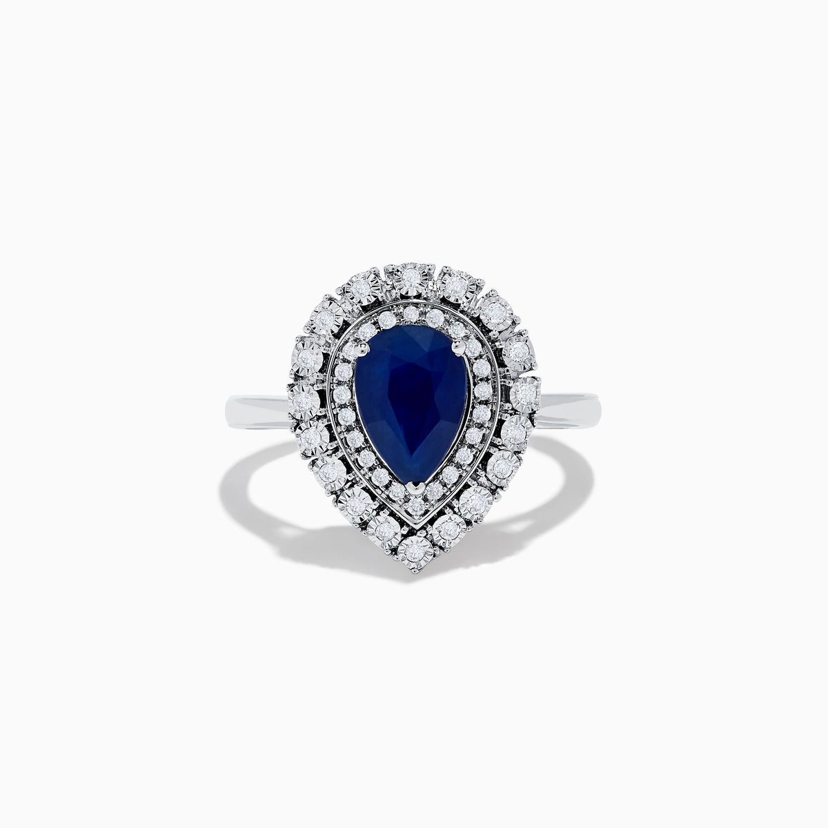 The Royale Bleu 14K White Gold Sapphire Diamond Ring showcases a pear-shaped sapphire center, encircled by two rows of sparkling round white diamonds in an elegant teardrop halo design.