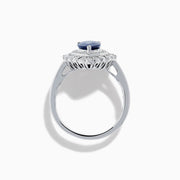 The Royale Bleu 14K White Gold Sapphire Diamond Ring showcases a pear-shaped sapphire center, encircled by two rows of sparkling round white diamonds in an elegant teardrop halo design.