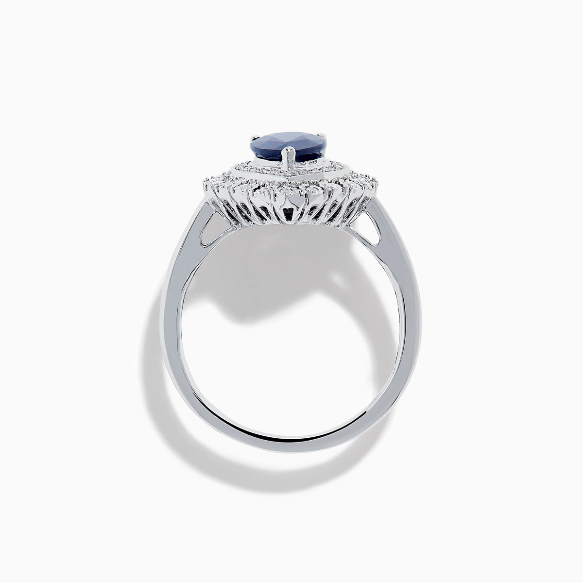 The Royale Bleu 14K White Gold Sapphire Diamond Ring showcases a pear-shaped sapphire center, encircled by two rows of sparkling round white diamonds in an elegant teardrop halo design.