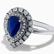 The Royale Bleu 14K White Gold Sapphire Diamond Ring showcases a pear-shaped sapphire center, encircled by two rows of sparkling round white diamonds in an elegant teardrop halo design.