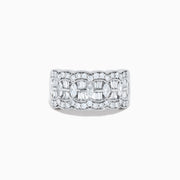 Experience timeless elegance with the 14K White Gold Diamond Multi Shape Wide Band Ring, showcasing two rows of brilliant round diamonds that border a central row of rectangular baguette-cut diamonds arranged in an intricate, repeating pattern.