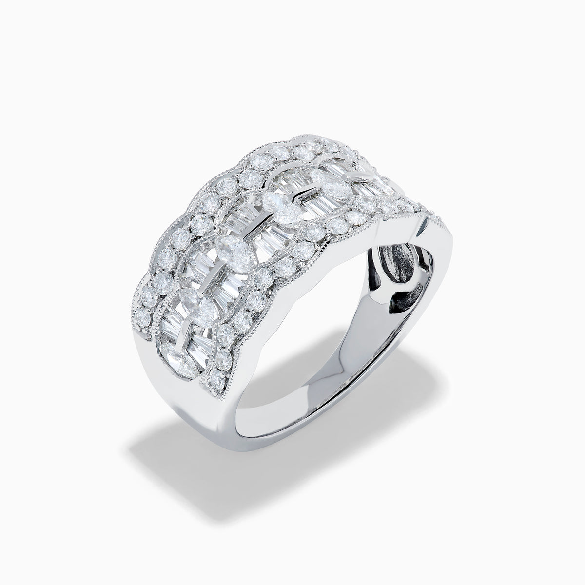 Experience timeless elegance with the 14K White Gold Diamond Multi Shape Wide Band Ring, showcasing two rows of brilliant round diamonds that border a central row of rectangular baguette-cut diamonds arranged in an intricate, repeating pattern.