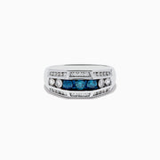 The Mens 14K White Gold Blue and White Diamond Ring showcases three blue stones between two white diamonds, with extra smaller white diamonds set in parallel rows along the band.