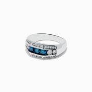 The Mens 14K White Gold Blue and White Diamond Ring showcases three blue stones between two white diamonds, with extra smaller white diamonds set in parallel rows along the band.