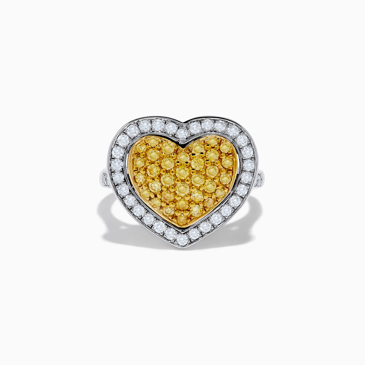 The Canare 18K Two Tone Gold Yellow Diamond Heart Ring, featuring a yellow diamond center with clear white stones on a silver band, is displayed against a white background.