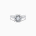 The Pave Classica 14K White Gold Diamond Ring showcases a round center stone surrounded by a double halo of diamonds, set on a polished band and photographed against a white background.