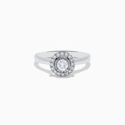 The Pave Classica 14K White Gold Diamond Ring showcases a round center stone surrounded by a double halo of diamonds, set on a polished band and photographed against a white background.