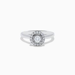 The Pave Classica 14K White Gold Diamond Ring showcases a round center stone surrounded by a double halo of diamonds, set on a polished band and photographed against a white background.