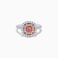 The 18K Two Tone Gold White and Pink Diamond Ring showcases a square pink center stone, encircled by a halo of pink diamonds and a second halo of white diamonds, with more diamonds set along its sophisticated band.