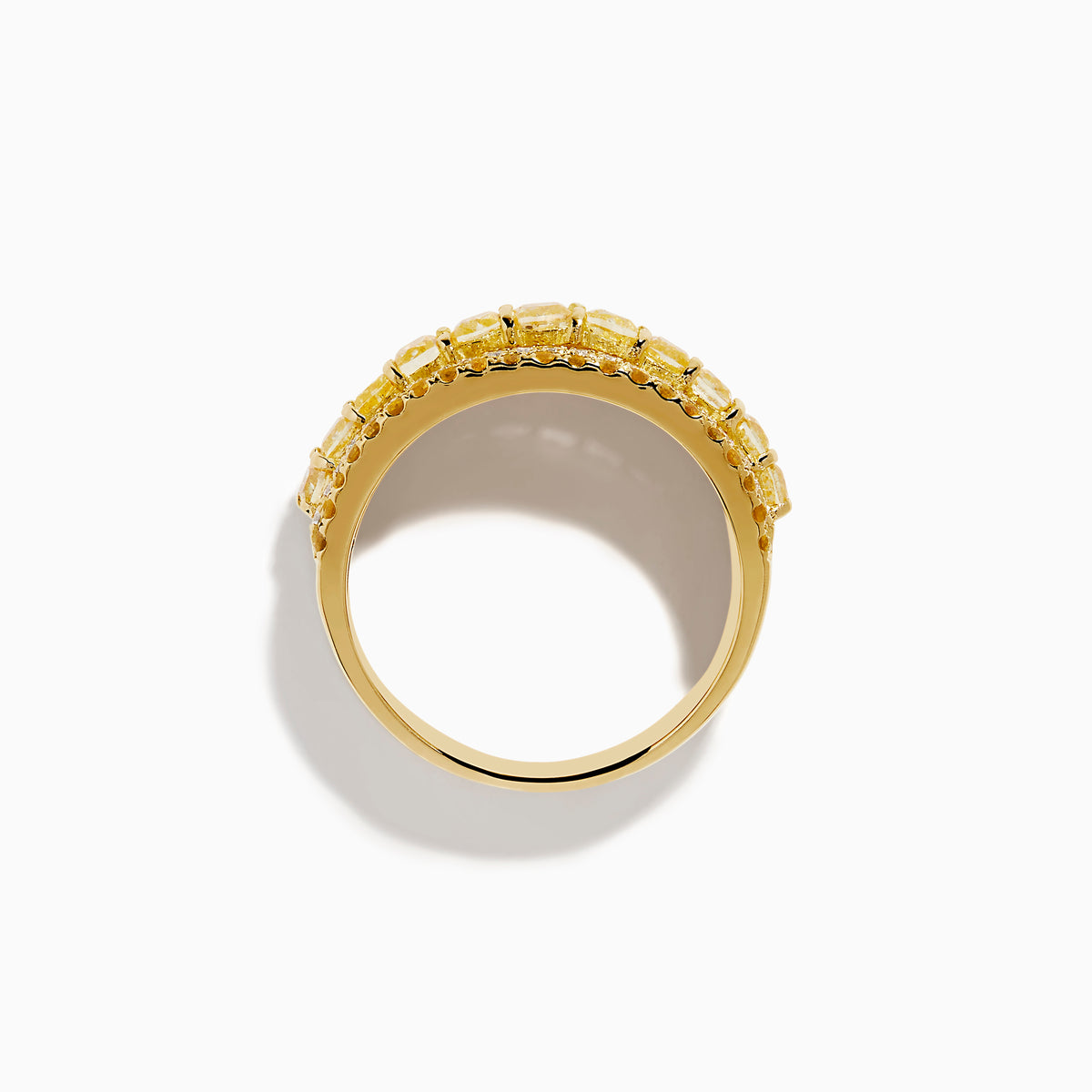 The Canare 18K Yellow Gold Yellow Diamond Band Ring features alternating rows of sparkling yellow and white gemstones set around the band.
