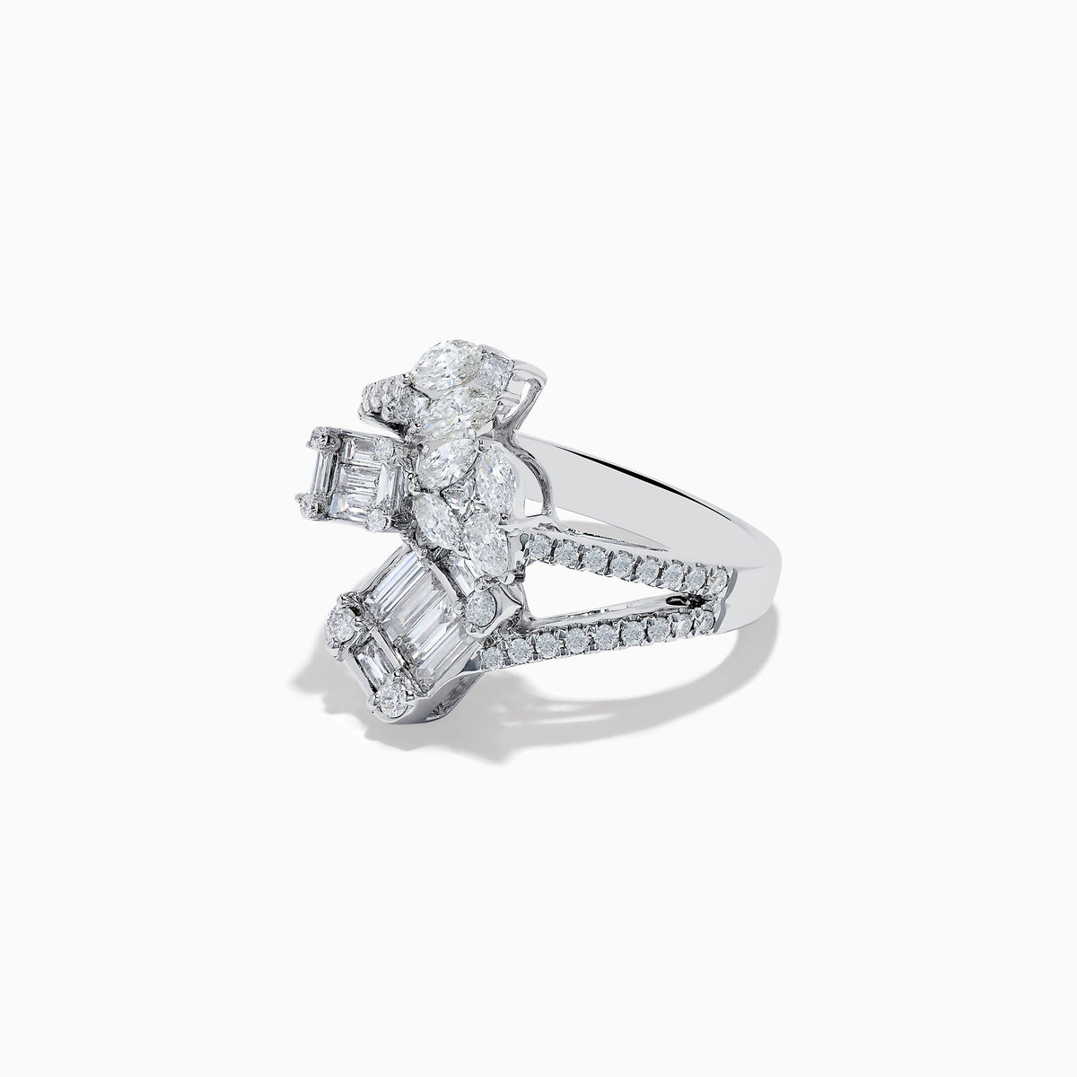 The Classique 14K White Gold Diamond Crossover Ring features an elegant, twisting band set with round and baguette-cut diamonds, shown against a white background.
