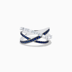 The Royale Bleu 14K White Gold Blue Sapphire and Diamond Crossover Ring features three overlapping bands—two accented with blue sapphires and one with clear rectangular diamonds—shown on a white background.