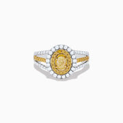 A close-up of the Canare 18K Two Tone Gold White and Yellow Diamond Ring, showcasing a yellow center stone in a halo of yellow and white diamonds on a split band with additional white and yellow diamonds.