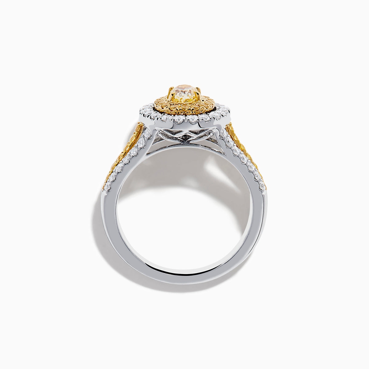 A close-up of the Canare 18K Two Tone Gold White and Yellow Diamond Ring, showcasing a yellow center stone in a halo of yellow and white diamonds on a split band with additional white and yellow diamonds.