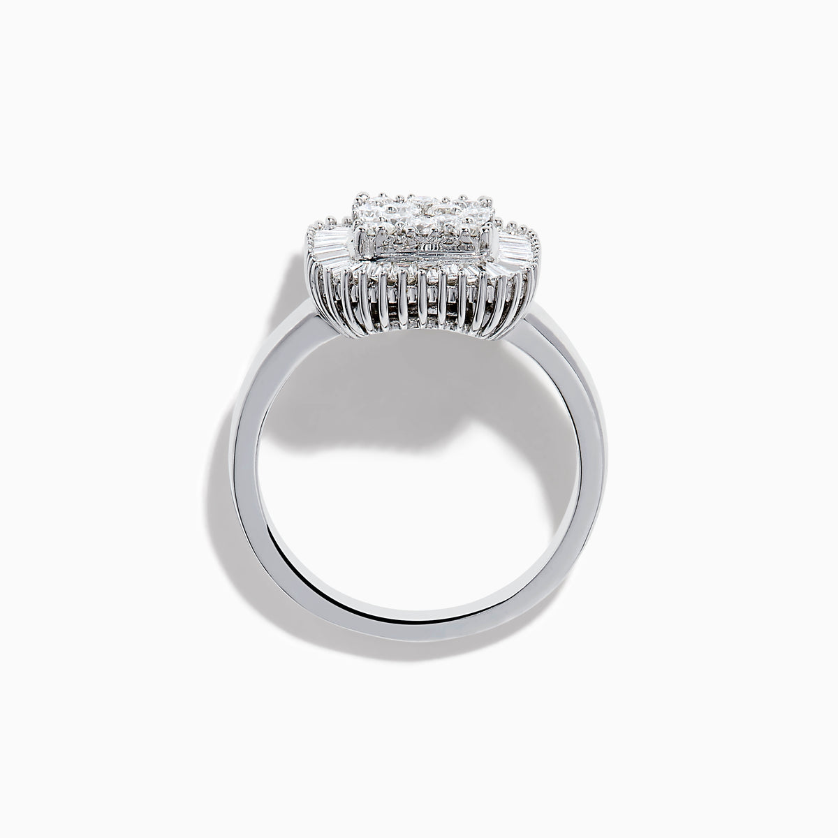 The 14K White Gold Diamond Statement Ring showcases a square-shaped setting with a cluster of round diamonds at the center, bordered by baguette-cut diamonds.