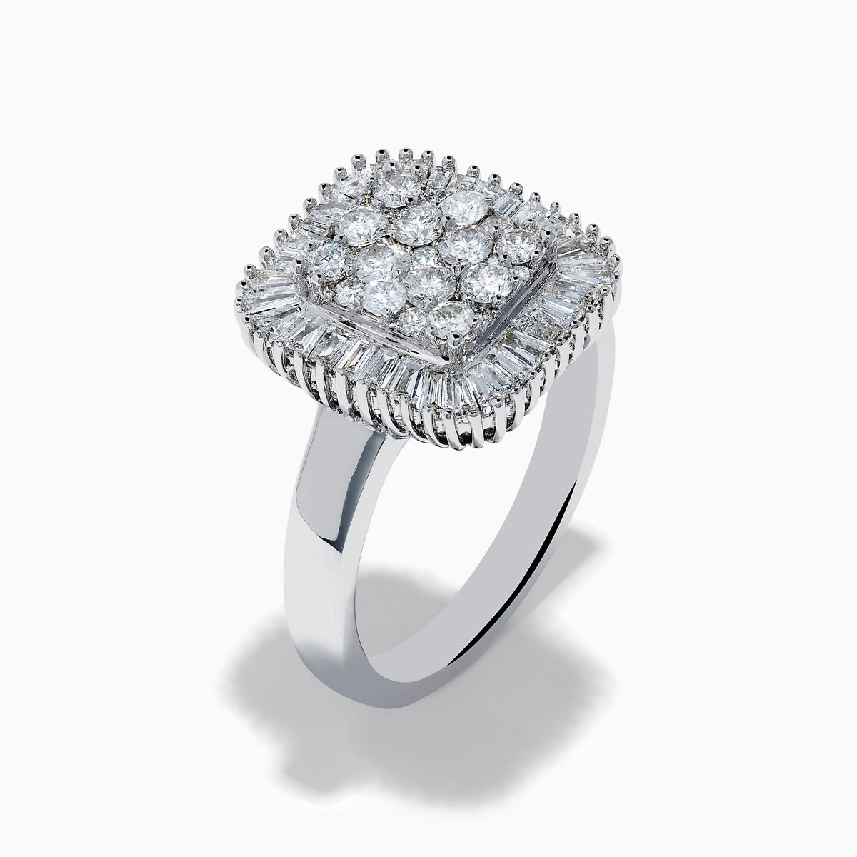 The 14K White Gold Diamond Statement Ring showcases a square-shaped setting with a cluster of round diamonds at the center, bordered by baguette-cut diamonds.