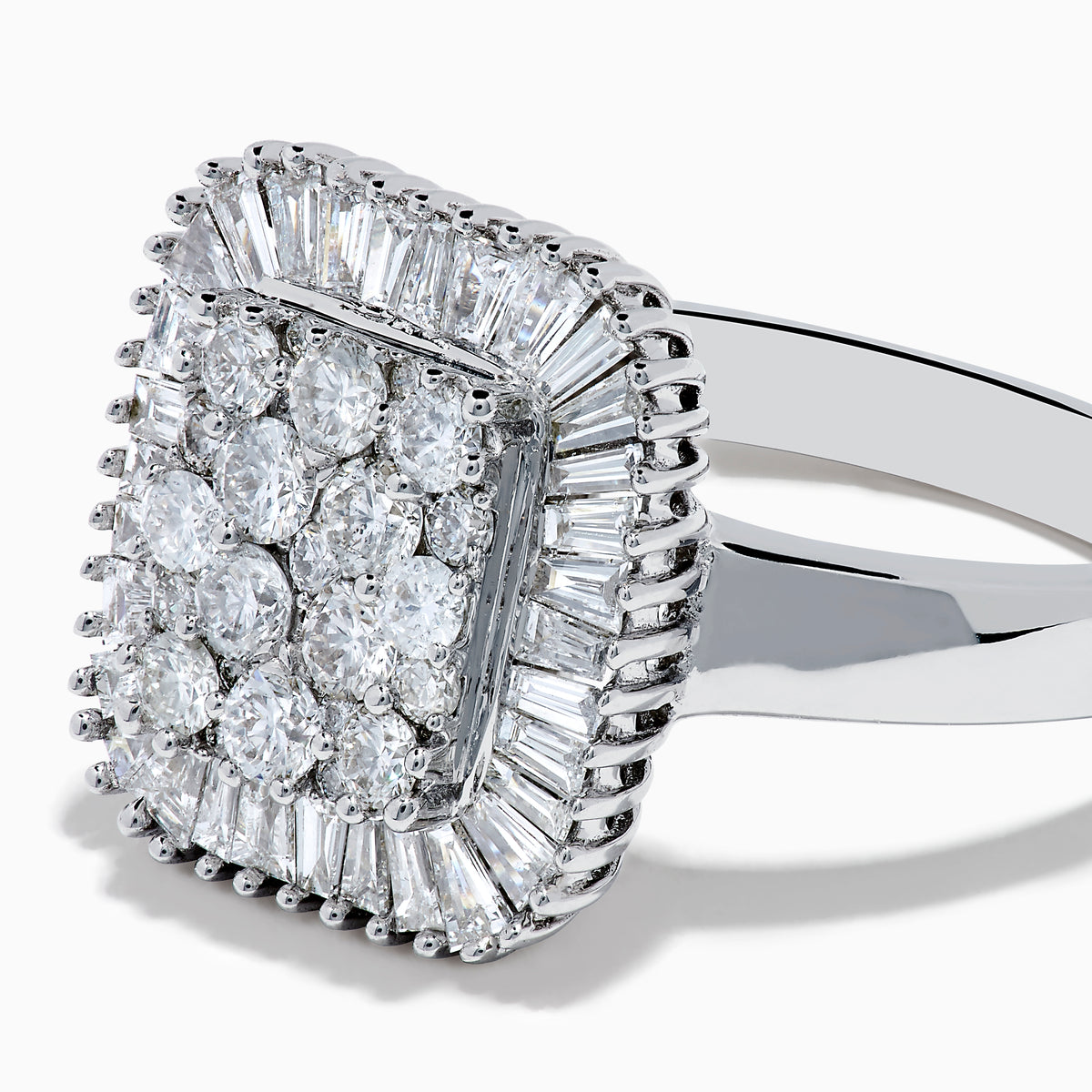The 14K White Gold Diamond Statement Ring showcases a square-shaped setting with a cluster of round diamonds at the center, bordered by baguette-cut diamonds.