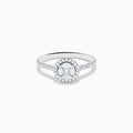 The Bouquet 14K White Gold Diamond Cluster Ring features an oval center diamond with a halo of smaller diamonds and a diamond-studded band, beautifully displayed against a plain white background.