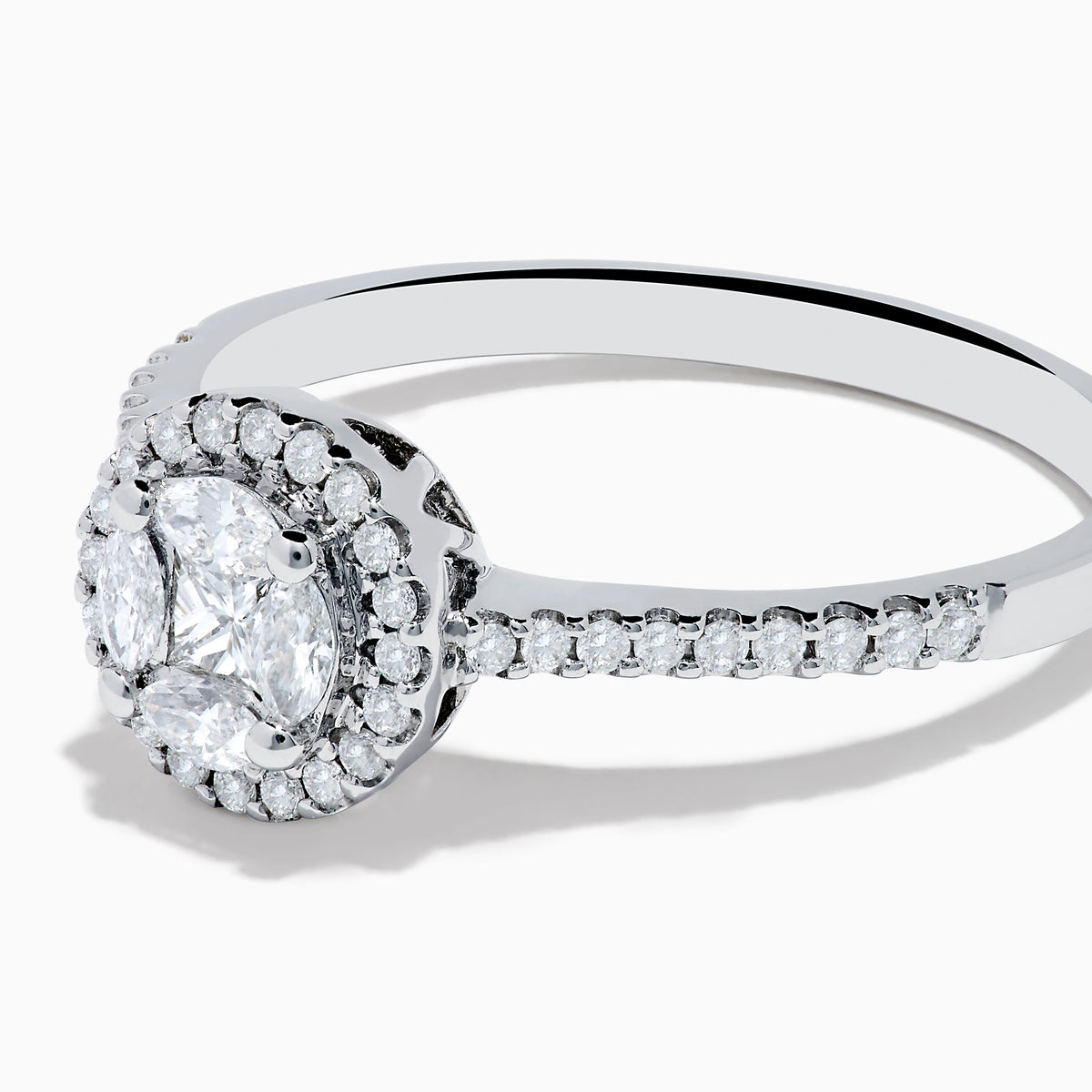 The Bouquet 14K White Gold Diamond Cluster Ring features an oval center diamond with a halo of smaller diamonds and a diamond-studded band, beautifully displayed against a plain white background.