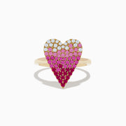 The 14K Yellow Gold Pink Sapphire & Diamond Heart Ring features a heart-shaped top with diamonds, pink sapphires, and deep red stones in a gradient grid pattern.