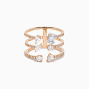 The Pave Rose 14K Rose Gold Diamond Ring features four open bands adorned with pavé diamonds and assorted clear gemstones—including teardrop and rectangular cuts—for an elegant, multi-layered look.