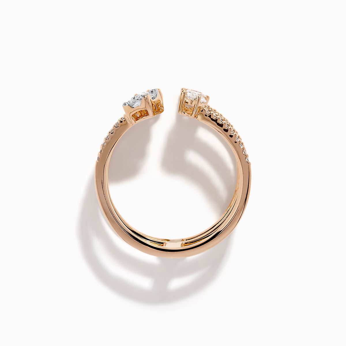 The Pave Rose 14K Rose Gold Diamond Ring features four open bands adorned with pavé diamonds and assorted clear gemstones—including teardrop and rectangular cuts—for an elegant, multi-layered look.