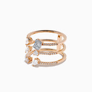 The Pave Rose 14K Rose Gold Diamond Ring features four open bands adorned with pavé diamonds and assorted clear gemstones—including teardrop and rectangular cuts—for an elegant, multi-layered look.