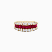 The Ruby Royale 14K Yellow Gold Princess Cut Ruby & Diamond Band features two rows of round white diamonds and a central row of princess-cut rubies, elegantly set on a white background.